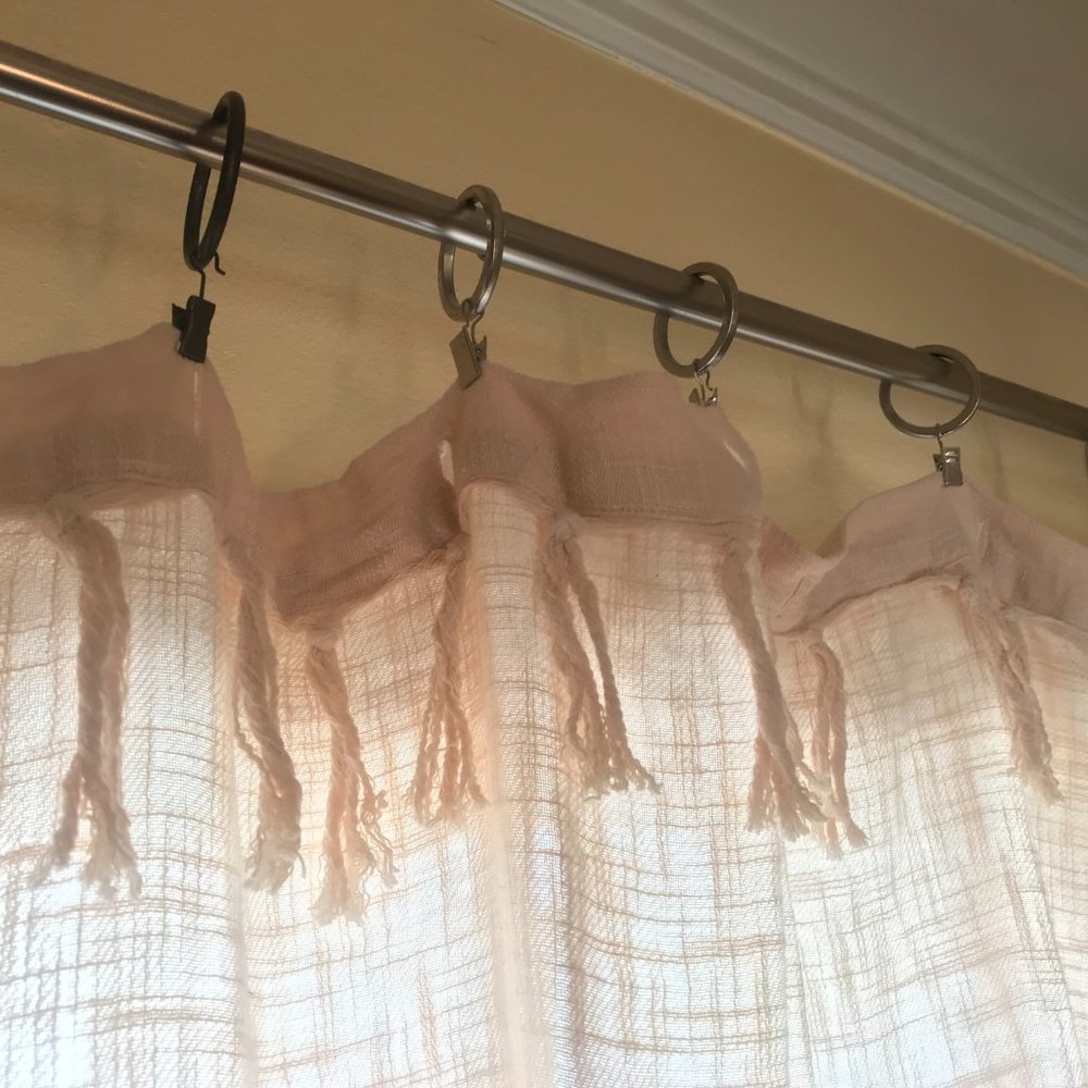 Creme curtain .  may be linen - Almost white curtain with tassles